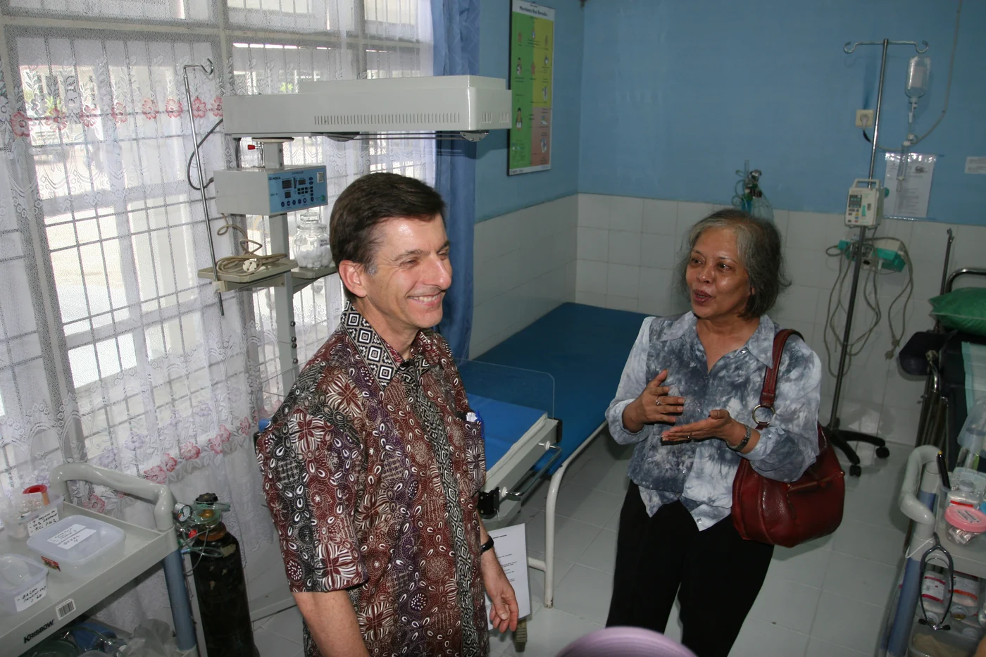 Officials visit a maternity care room at an Indonesian hospital participating in a USAID-supported program